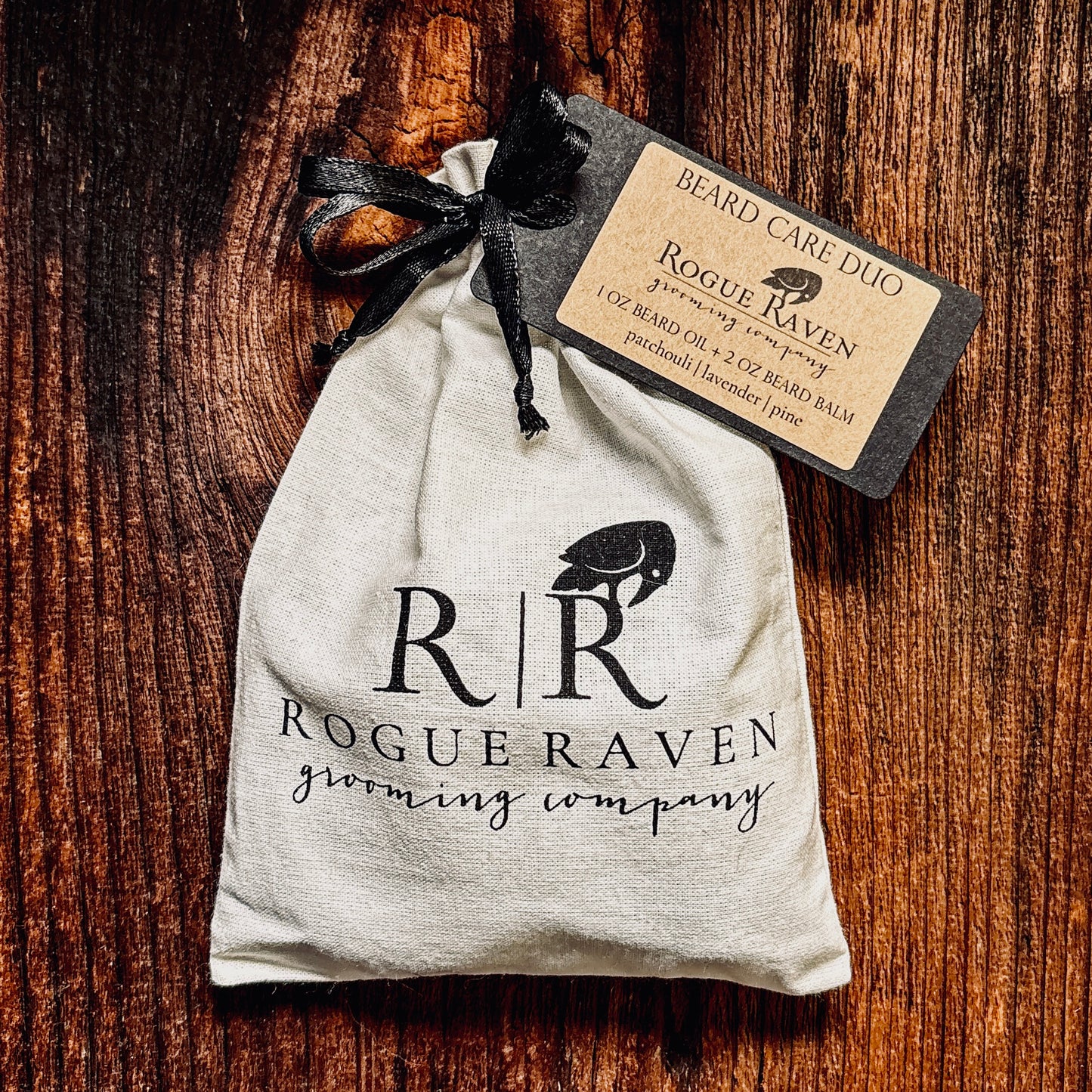 Beard care duo from Rogue Raven Grooming packaged in a cotton drawstring bag with company logo.