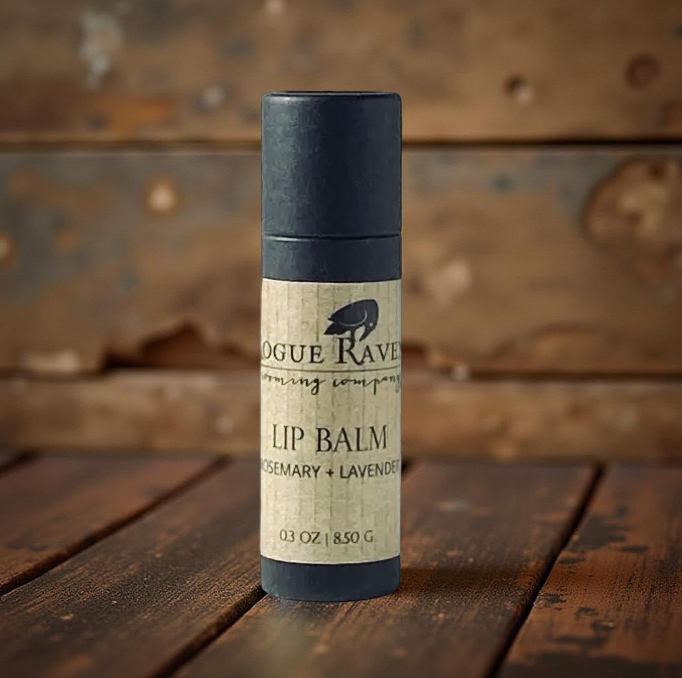 An eco-friendly cardboard push-up tube of all-natural lip balm. ROSEMARY + LAVENDER from Rogue Raven Grooming.