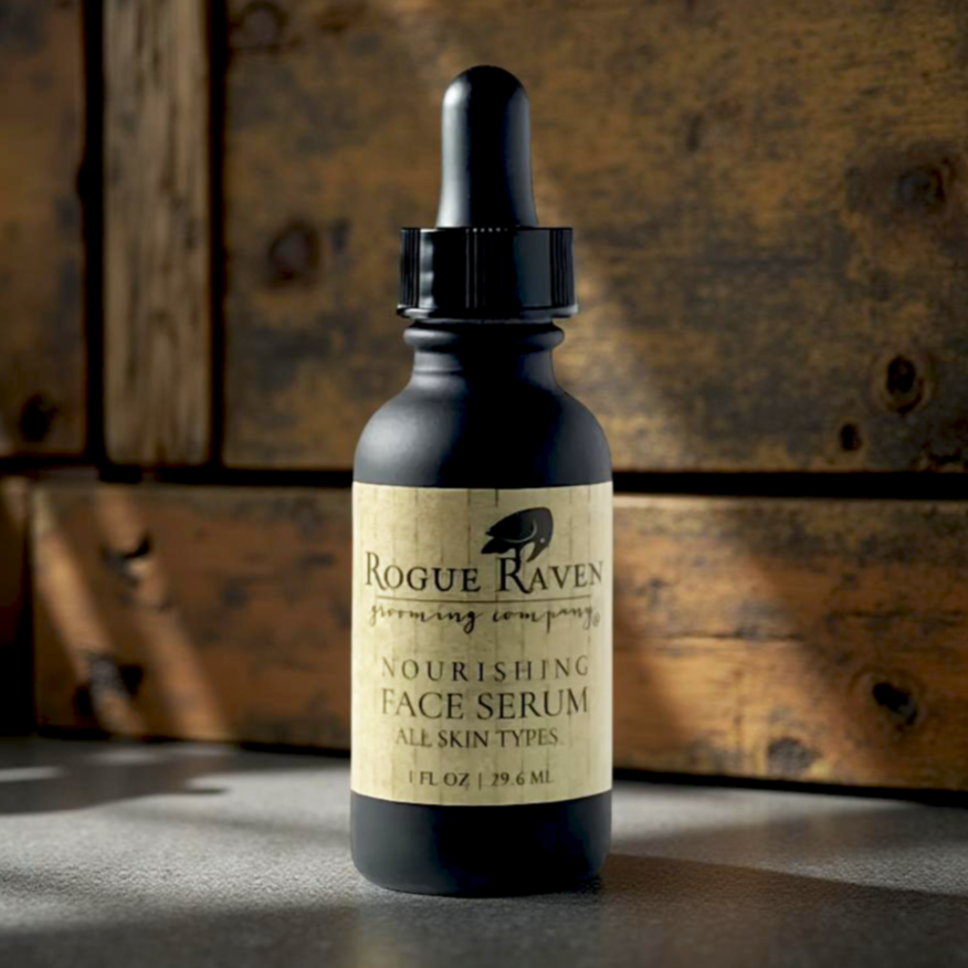 Bottle of Rogue Raven face serum on a wooden surface