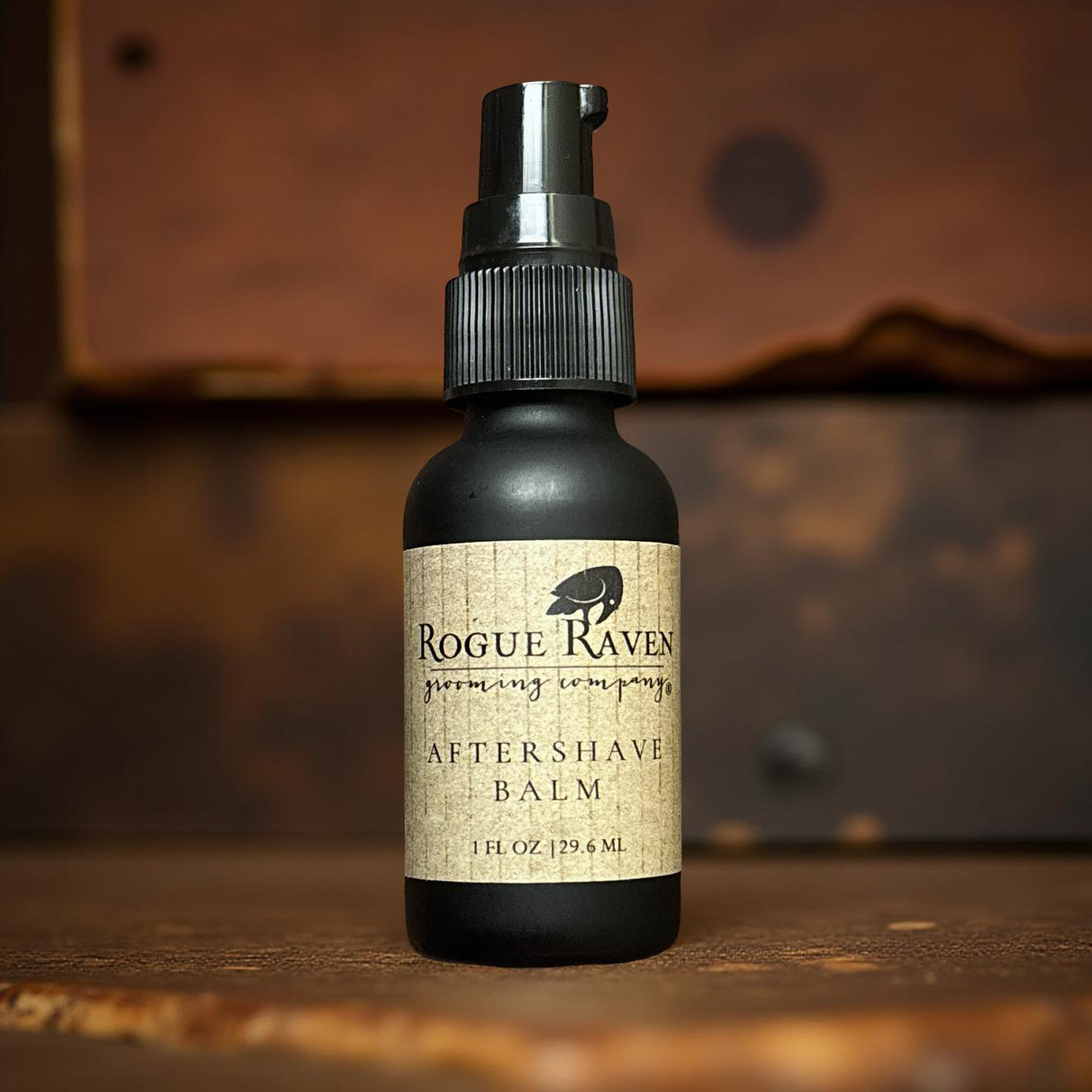 Black frosted glass bottle of aftershave balm from Rogue Raven Grooming