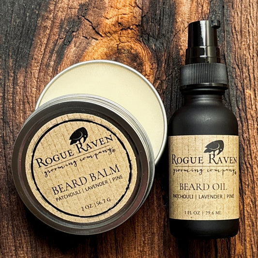 Beard balm and oil from Rogue Raven on a wooden surface