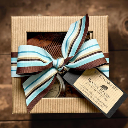 Father’s Day Beard Care Kit: beard oil, beard balm, and wooden comb. Packaged in window gift box with ribbon.