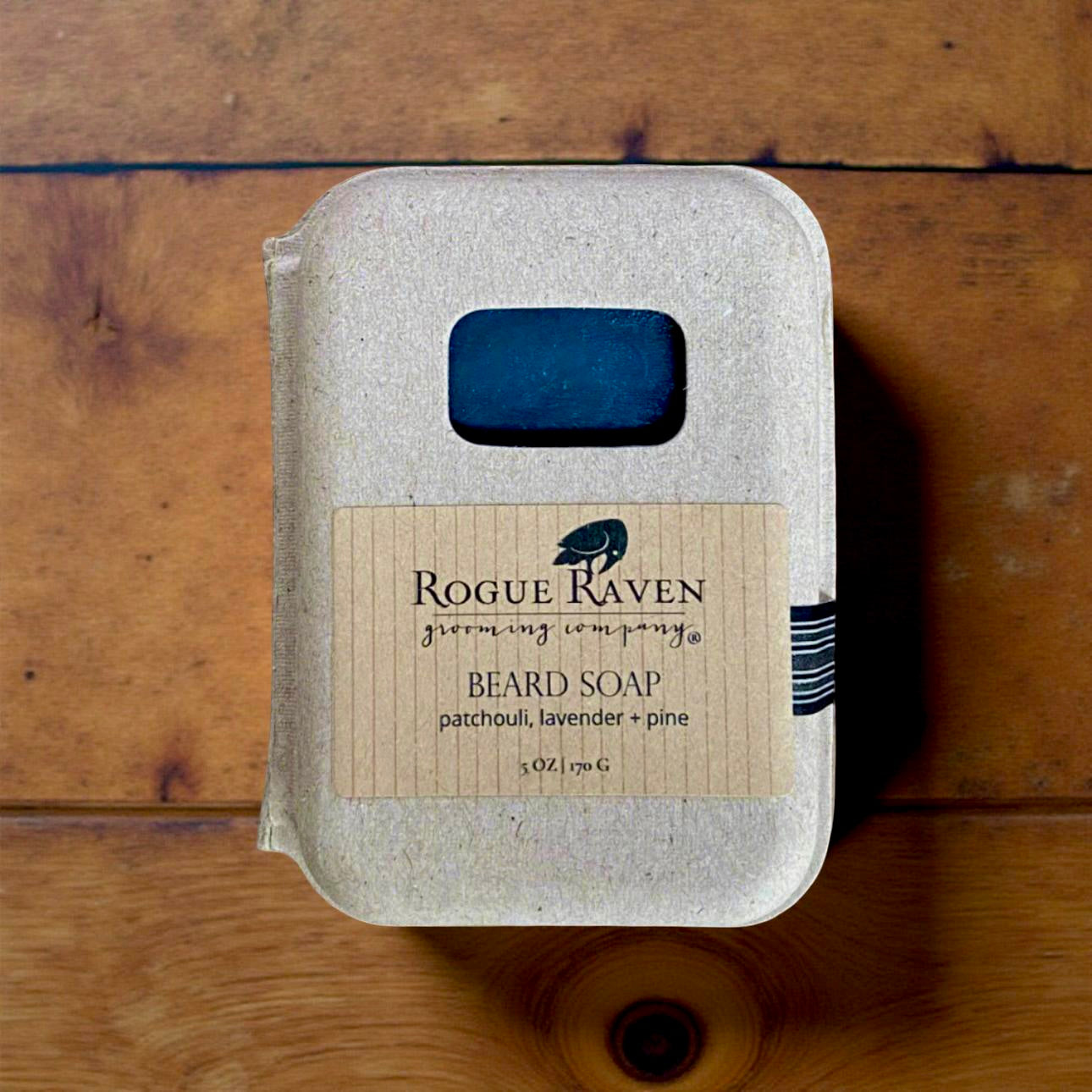 Hand-cut cold-pressed bar of Rogue Raven Beard Soap in recycled cardboard clamshell box